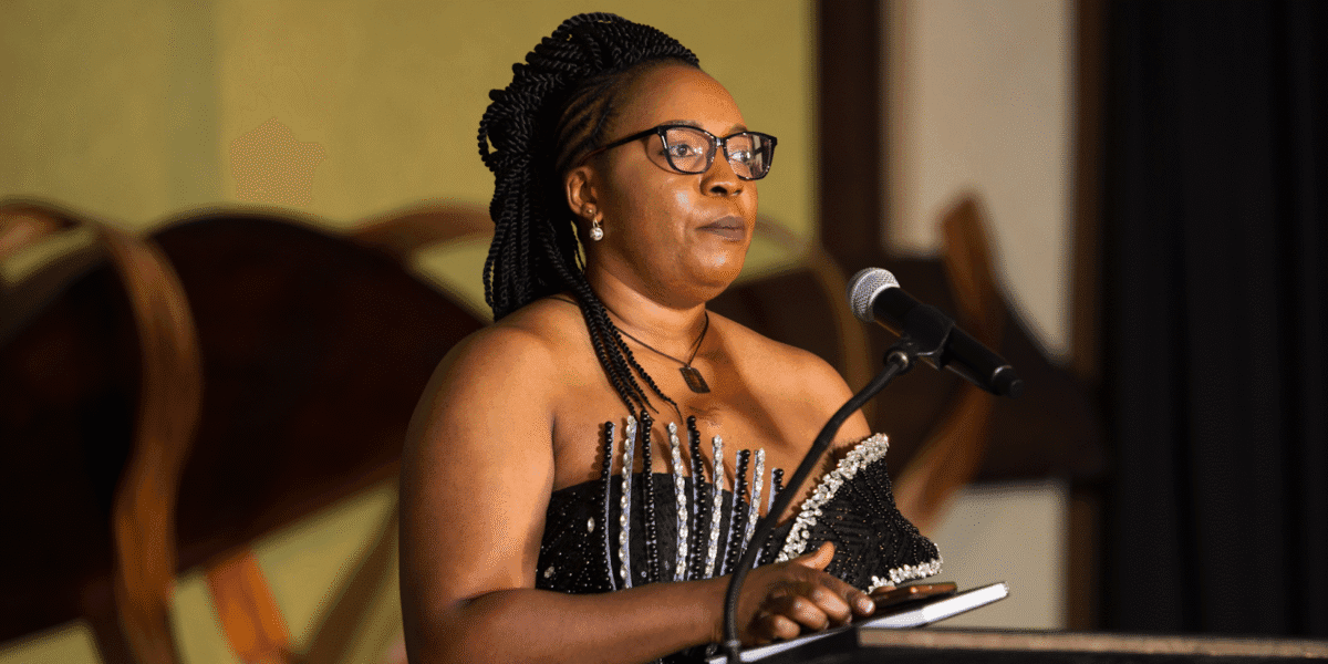 Chantale C. Nyonka speaking at an event, inspiring mindset transformation.