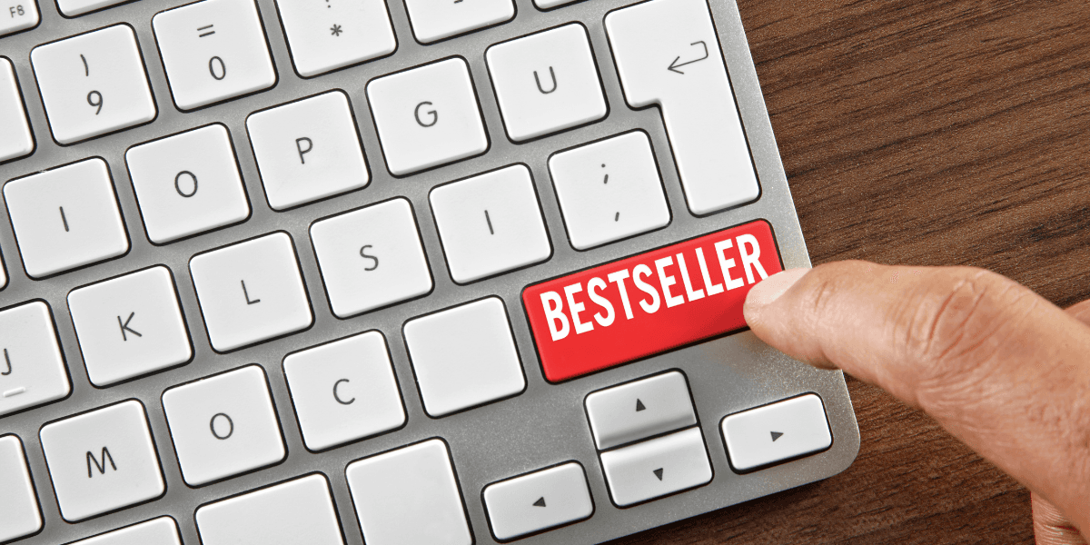 Finger pressing a keyboard key labeled "Bestseller."