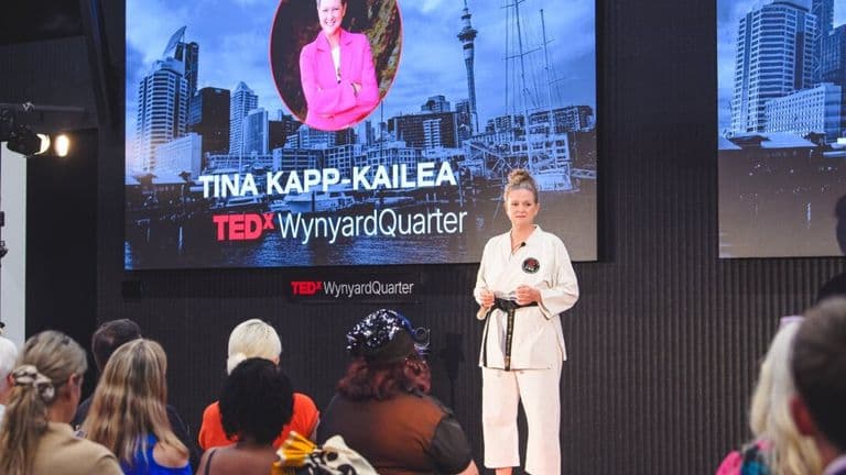 Tina Kapp-Kailea speaking on stage at TEDxWynyardQuarter.