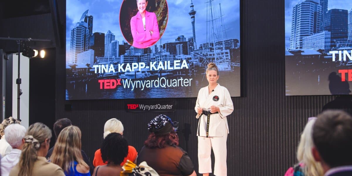 Tina Kapp-Kailea speaking on stage at TEDxWynyardQuarter.