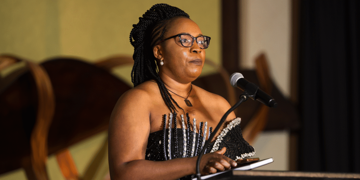 Chantale C. Nyonka speaking at an event, inspiring mindset transformation.