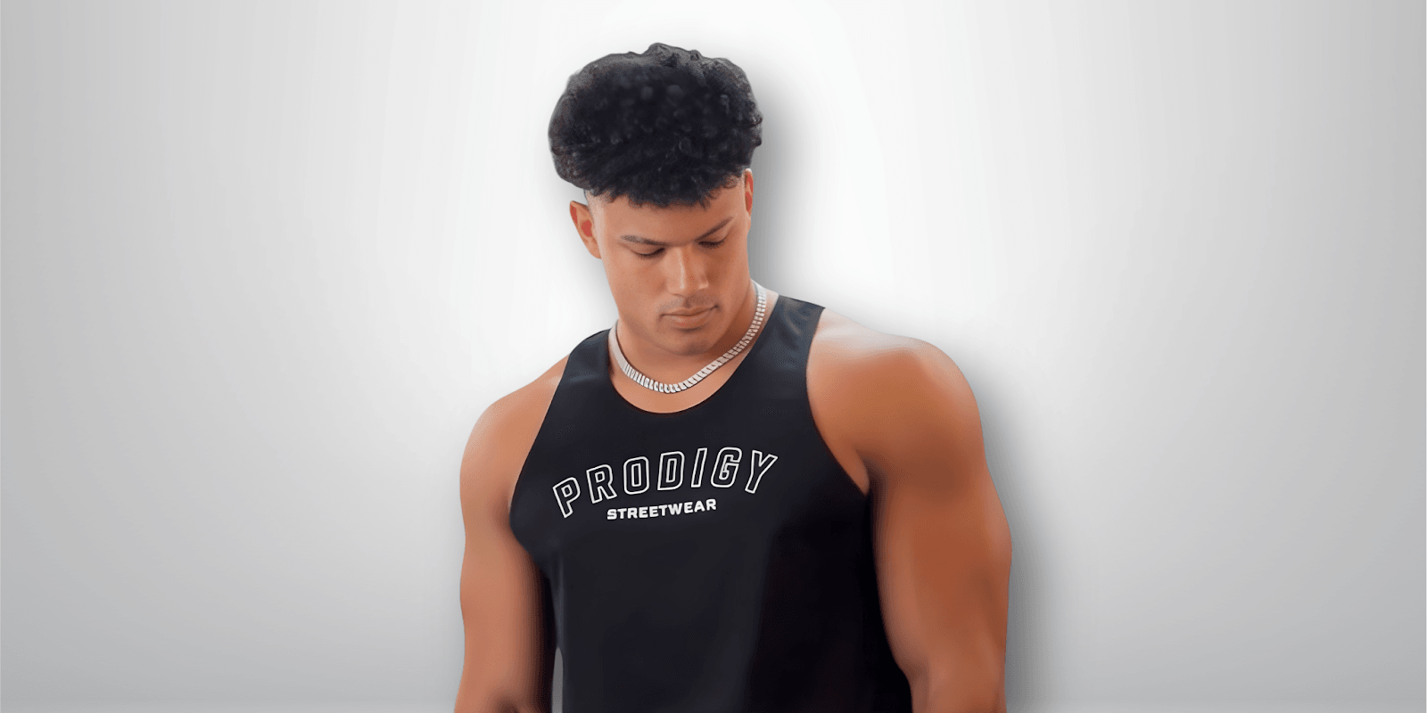 "Trey Bailey, founder of Prodigy Streetwear, inspiring global growth through fitness and ambition, featuring the 'Mentality Drop' collection."