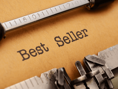 Close-up of a typewriter with paper showing the words Best Seller typed on it