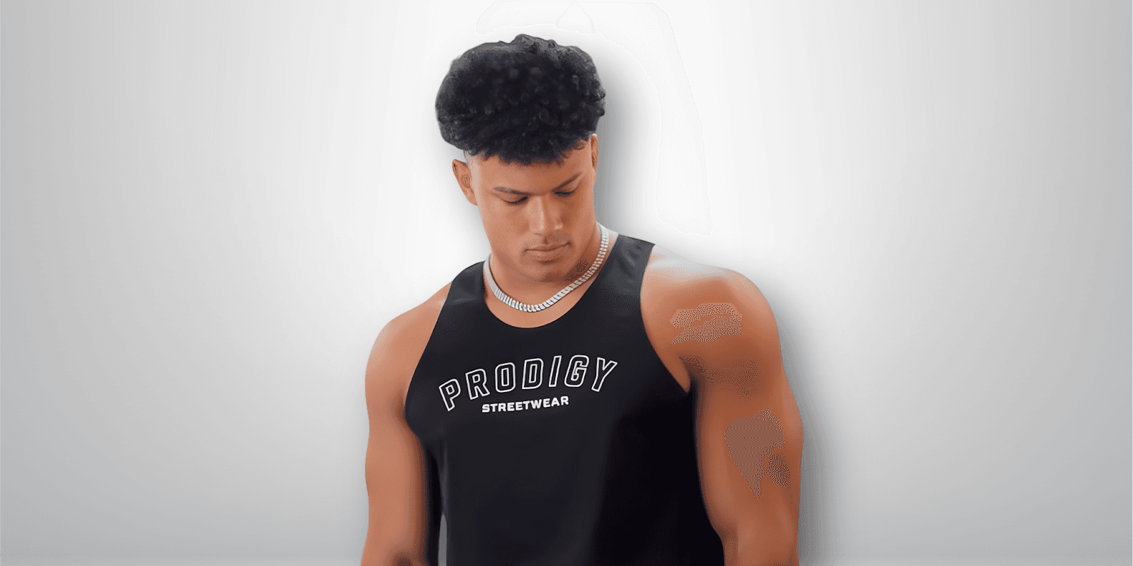 "Trey Bailey, founder of Prodigy Streetwear, inspiring global growth through fitness and ambition, featuring the 'Mentality Drop' collection."